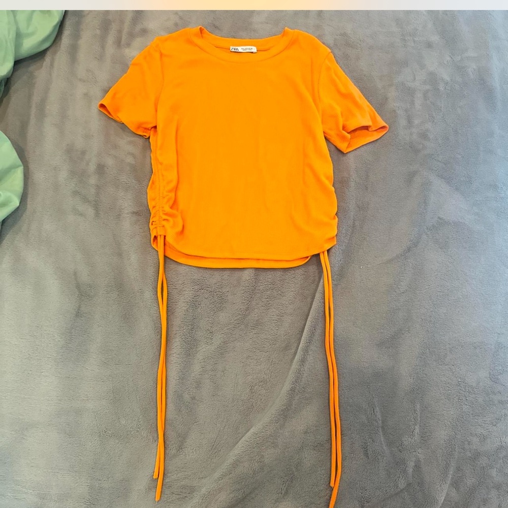 Zara woman’s orange shirt